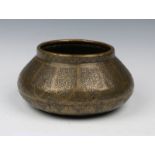 AN EARLY SYRIAN ENGRAVED OVOID BOWL decorated with alternating compartments of Islamic script,