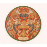 AN INDO-PERSIAN CIRCULAR POTTERY PLAQUE with polychrome dancing figure decoration, 26.5cm diameter