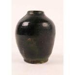 A JAPANESE BLACK GLAZE RAKU POTTERY VASE of tapering form, 12cm high