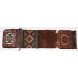 AN AFSHAR KHORJIN with flat weave back and stylised brick red and green foliate decoration, 90 x