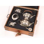 A HAMILTON & CO (CALCUTTA) SILVER FOUR PIECE TEA SERVICE consisting of a teapot, tea kettle on stand