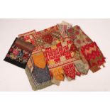 A COLLECTION OF NINE PIECES OF EASTERN TEXTILES of varying country of origin and design