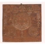 A NEPALESE BEATEN COPPER PLAQUE with inscription and embossed decoration, 30 x 27cm