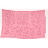 A LARGE EUROPEAN COTTON BED COVER with embroidered foliate scroll decoration, later dyed rose red,