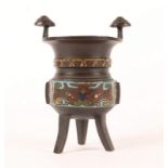 AN ANTIQUE ORIENTAL CHAMPLEVÉ ENAMELLED BRONZE CENSER with a triform base, 6cm high