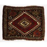 A QASHQ'AI BAGFACE with geometric and hooked decoration within a multi-colour border, 70 x 50cm