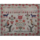 A VICTORIAN GROS POINT NEEDLEWORK SAMPLER with tulip, alphabet and bird decoration by Dinah