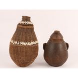 A KENYA SAMBURU TRIBE STRING AND COWRY SHELL MILK CONTAINER, 33cm high and a Rendili wooden honey