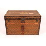 A LOUIS VUITTON CABIN TRUNK with monogram decoration, the lined interior with two trays, labelled