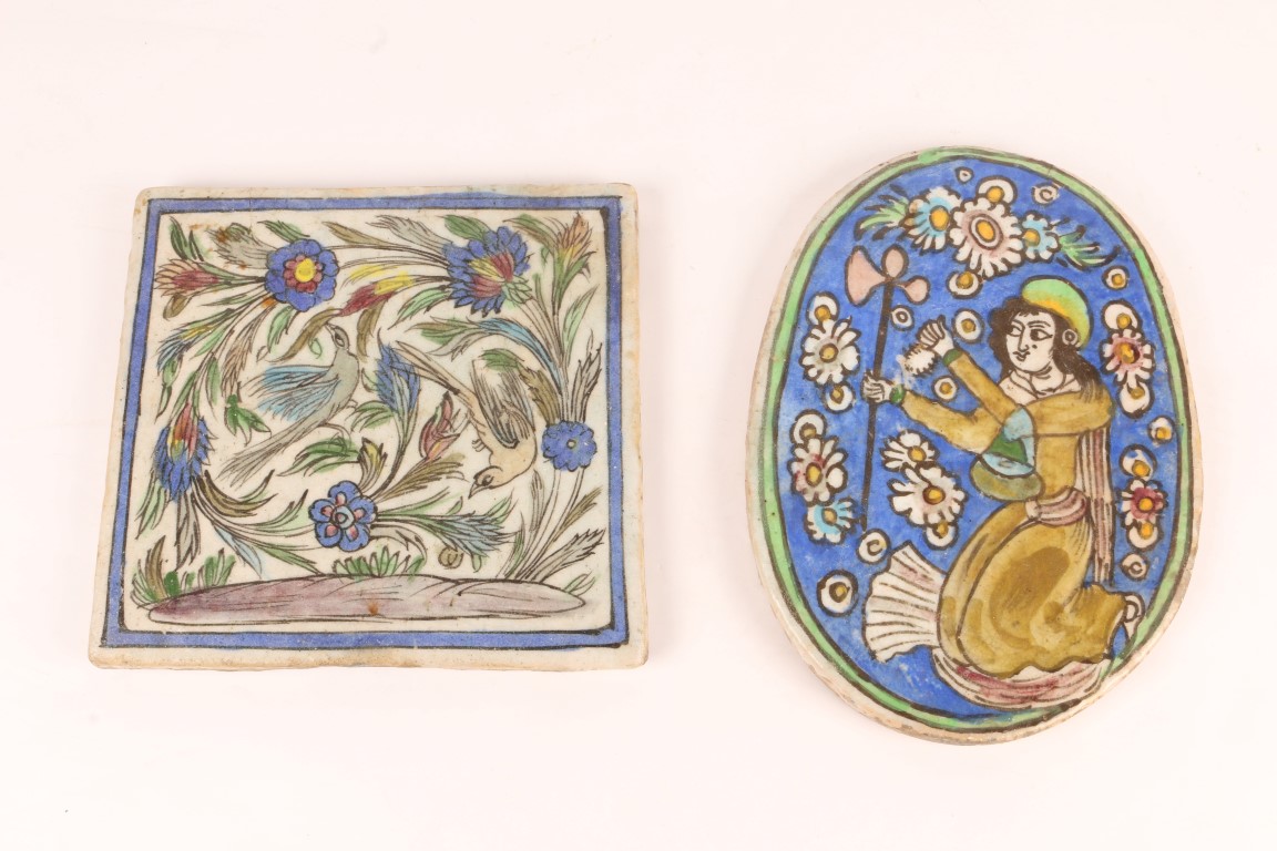 A MIDDLE EASTERN RECTANGULAR TILE with painted bird and foliate decoration, 24.5 x 23cm and an