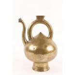 AN INDO-PERSIAN BRONZE EWER, 16th/17th Century, of onion form with open work handle and spout and