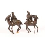 A PAIR OF CHINESE BRONZE FIGURES of Deities riding deer, 17cm high