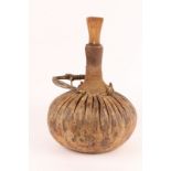 A TURKANO TRIBE CAMELS MILK CONTAINER with rope work decoration and wooden stopper, 47cm high