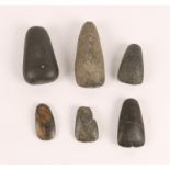 A COLLECTION OF SIX, POSSIBLY NIGERIAN, STONE AXE HEADS of simple tapering design (6)