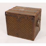 A LOUIS VUITTON LADIES CABIN TRUNK with stylised monogram decoration, metal and wooden bound, the