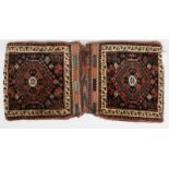 A NORTH WEST PERSIAN KHORJIN with flat weave back and geometric decoration, 64 x 33cm