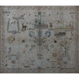 AN EXTENSIVE CHILD'S NEEDLEWORK SAMPLER with detailed biblical scenes within a scrolling border