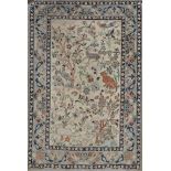 A TABRIZ WHITE GROUND MAT decorated symbols and birds amongst foliage and within a pale blue border,