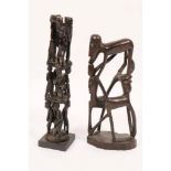 A TANZANIA, MAKONDE CARVED GROUP OF INTERTWINED FIGURES on a naturalistic base, 44cm high