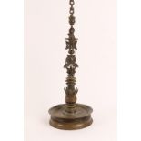 A MIDDLE EASTERN BRONZE HANGING LAMP with attached chain, bird ornament and circular base, perhaps a
