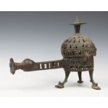 A PERSIAN, KHORASSAN BRONZE OPEN WORK CENSER with hinged rising lid, elongated handle, pierced
