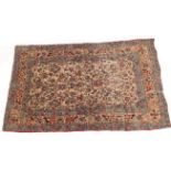 AN ANTIQUE EASTERN PRAYER RUG with all over foliate decoration in pastel colours and with a multiple