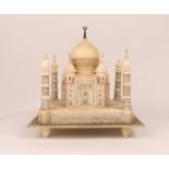 AN ALABASTER MODEL of the Taj Mahal on a decorative square base, 30cm square and approximately