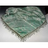 A SYRIAN PALE GREEN AND SILVER THREAD TABLE COVER with stylised foliate decoration