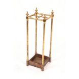 A VICTORIAN BRASS FOUR SECTIONAL STICK STAND with cast iron base, 61cm high