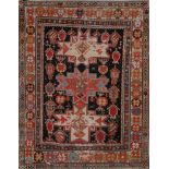 A CAUCASIAN BRICK RED GROUND RUG with geometric and stylised decoration within a triple border,