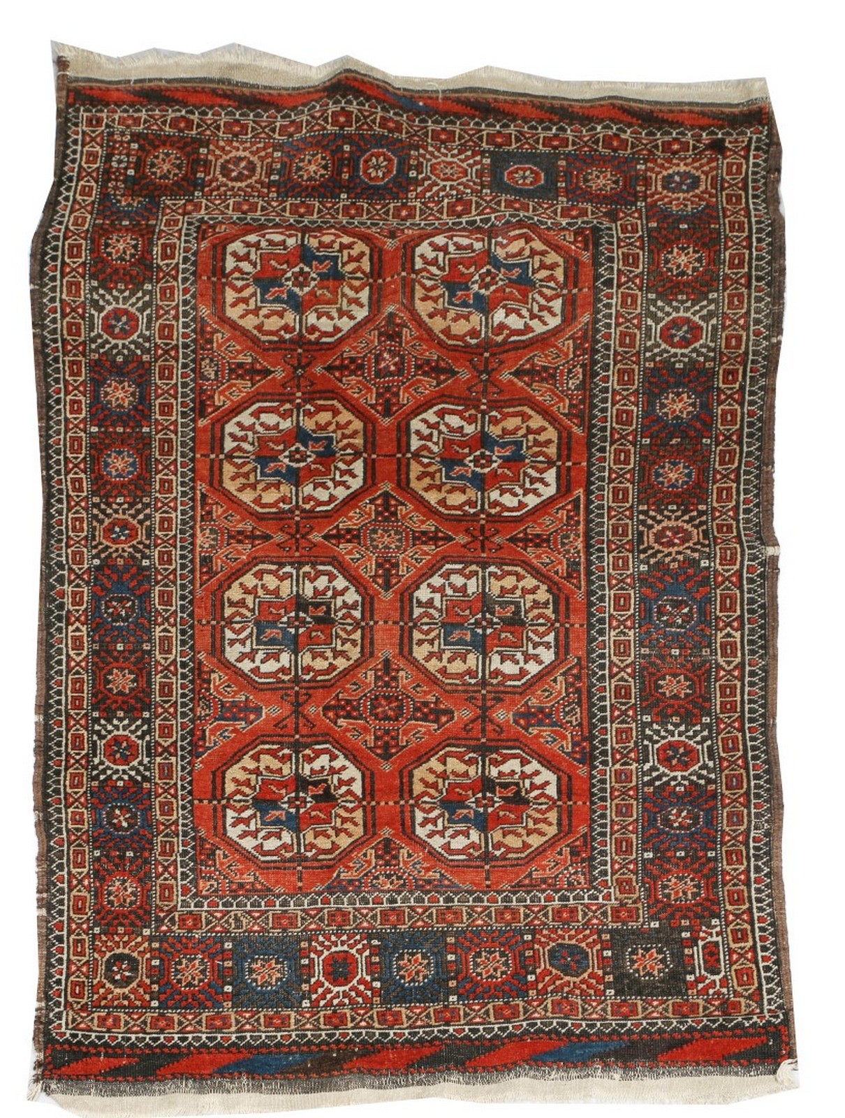 AN ANTIQUE BELOUCH RUG with two rows of four guls on a rust brown field with diagonal end borders,