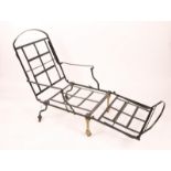 A VICTORIAN BLACK PAINTED AND BRASS FOLDING CAMPAIGN BED cum CHAIR with loose cushions, 68 x 66cm