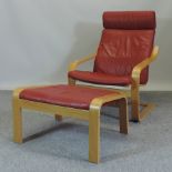 A modern beech and red leather arm chair