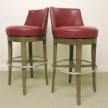 A pair of contemporary red leather uphol