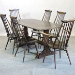 An Ercol dark elm dining suite, comprisi
