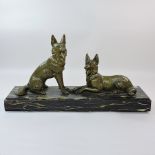 A bronze model of two dogs, 61cm wide