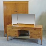 A 1970's teak wardrobe, together with a