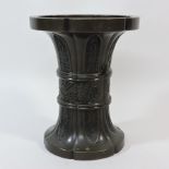 A Chinese bronze gu shaped vase, 19.5cm