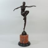 An Art Deco style bronze figure, on a ma