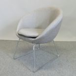 A pale grey upholstered office chair, on