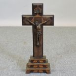 A continental inlaid wooden crucifix, on