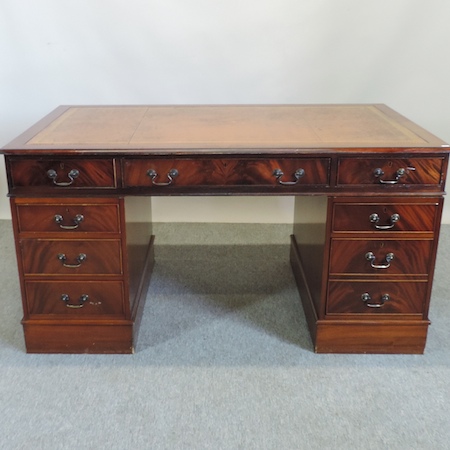 A reproduction mahogany pedestal desk, w