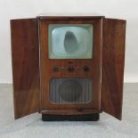 A 1950's walnut cased television cabinet