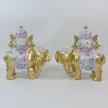 A pair of porcelain gilt painted elephan