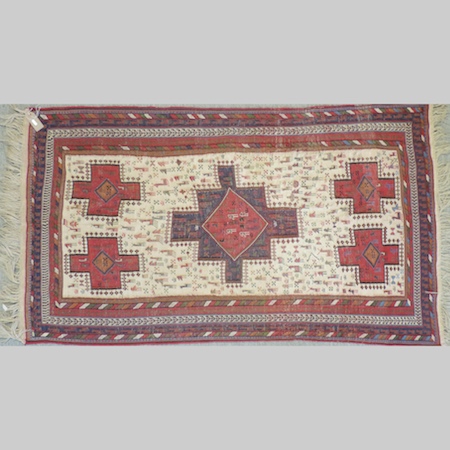 An Iranian rug, with a central medallion