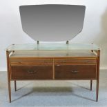 A 1970's dressing table, with a glass to
