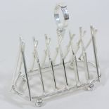 A silver plated novelty toast rack, 17cm