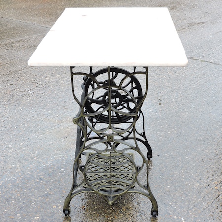 A Victorian Singer cast iron table, with