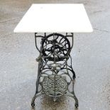 A Victorian Singer cast iron table, with