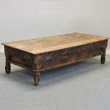 An Eastern carved hardwood coffee table,